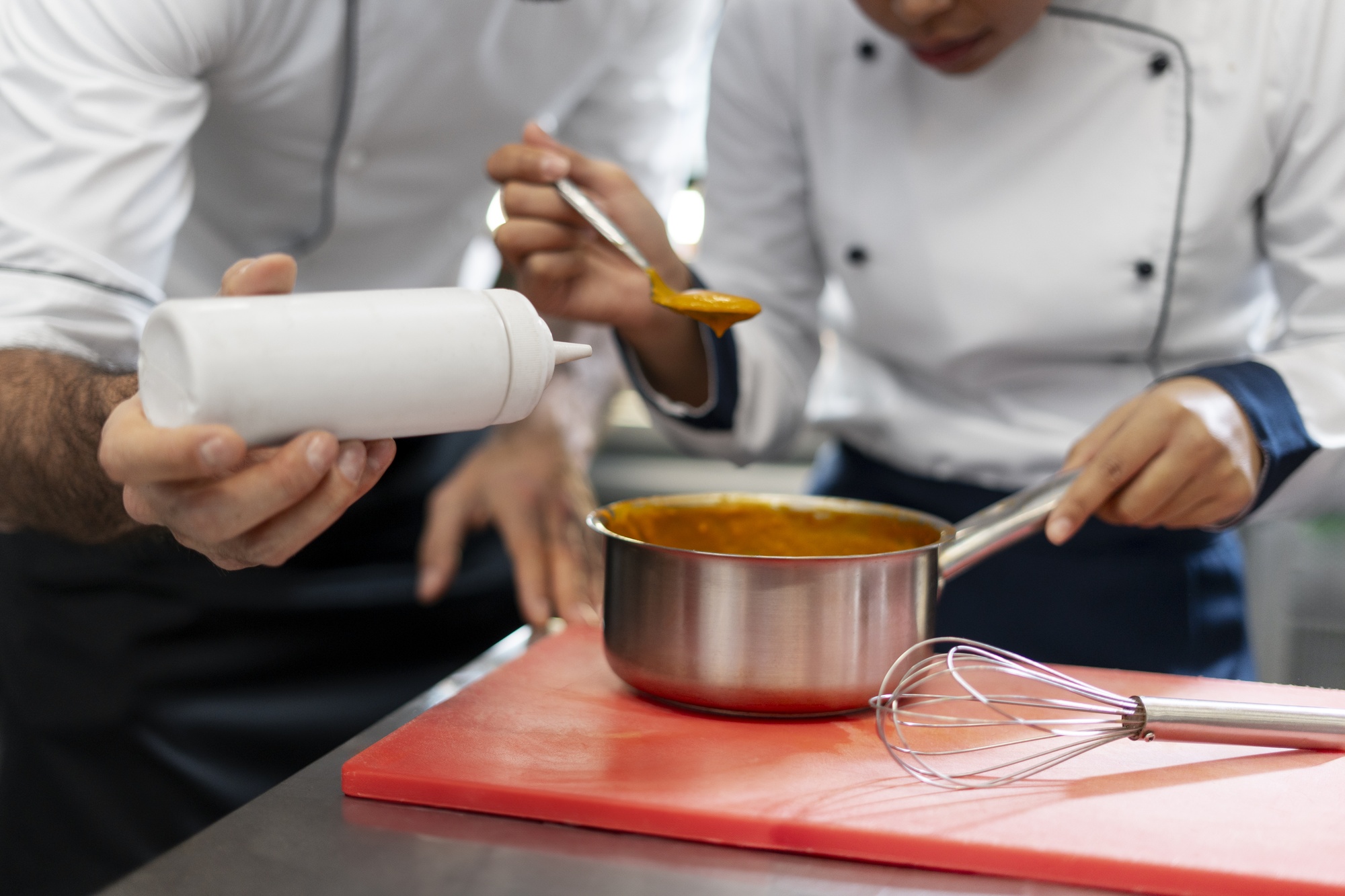 Instructor showing sauce technique