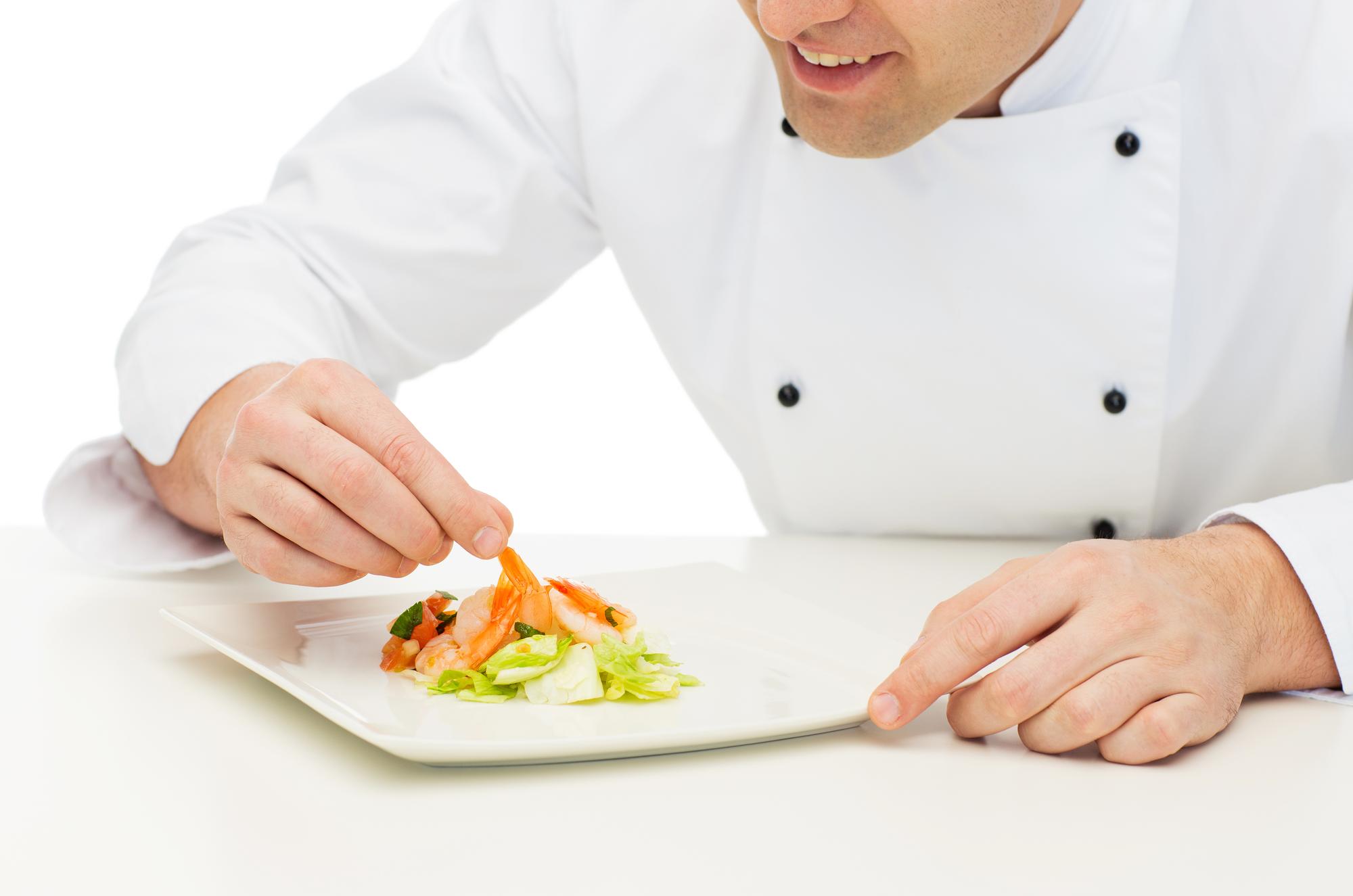 Instructor demonstrating plating on counter